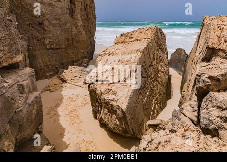 Picturesque rocky coastline at Varandinha beach on the vacation island of Boa Vista, Cape Verde Islands Stock Photo