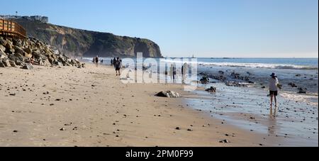 Strand Beach at low tide in Dana Point, Orange County, Southern California with Dana Point Headlands Conservation Area in the background. Stock Photo