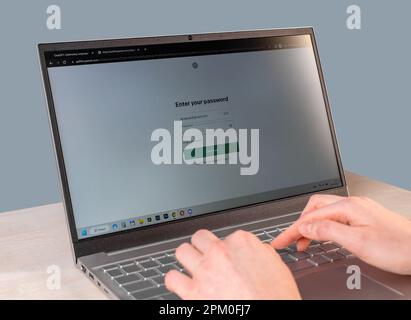Lodz, Poland April 07 2023 Entering login password on private account, site online, hands at laptop computer. Stock Photo