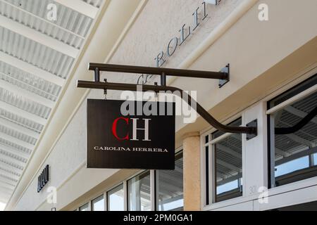 Close up of Carolina Herrera store sign on building is shown. Stock Photo