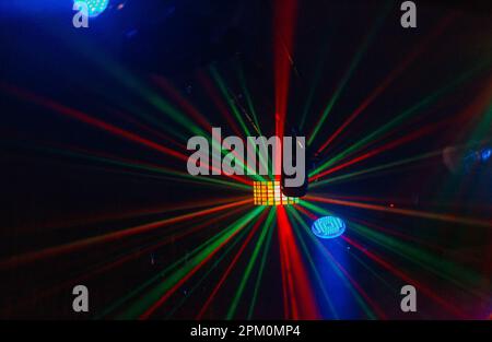 Multi -colored rays from lighting on the dance floor in a cafe Stock Photo