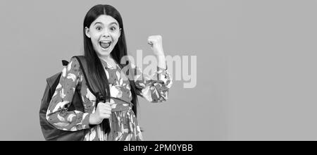 graduated. beautiful kid with long hair on blue background. Banner of schoolgirl student. School child pupil portrait with copy space. Stock Photo