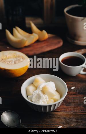 Vanilla Ice Cream with Honeydew Melon Slices in Bowl Stock Photo
