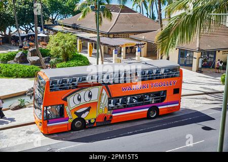 Waikiki, Oahu, Hawaii, USA, - February 6, 2023: View overlooking Kalakaua Ave in Waikiki where the Trolleys stop Stock Photo