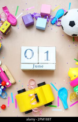 Date of Children's Day with toys on beige background Stock Photo