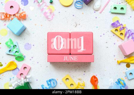 Calendar with date of Children's Day, toys and confetti on white background Stock Photo