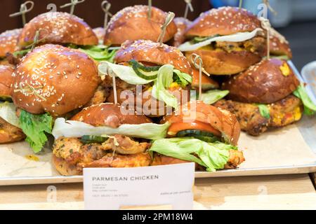a tray full of paresan chicken sandwiches London England Stock Photo