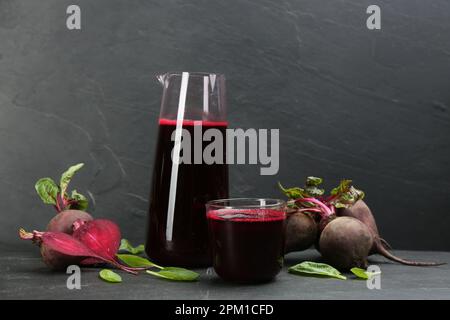 Freshly made beet juice on black table Stock Photo