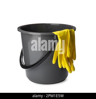 Grey bucket and rubber gloves on white background Stock Photo
