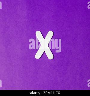 Uppercase letter X - wood texture - Purple background Stock Photo