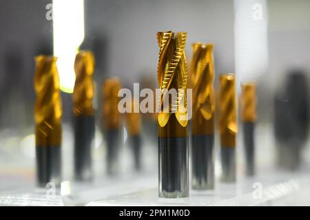 Set of drill spiral cutters with notches in hardware shop Stock Photo