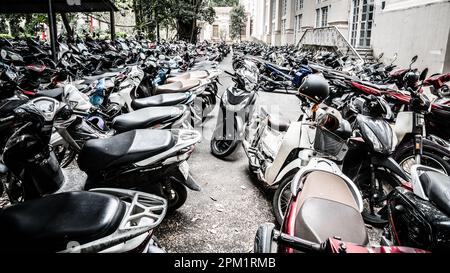 Hanoi, Vietnam, November 15., 2022: Scooter parking lot near an office building in Hanoi. Stock Photo