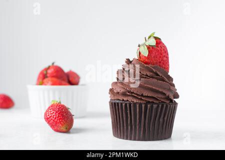 Chocolate cupcake with chocolate buttercream and strawberries, double