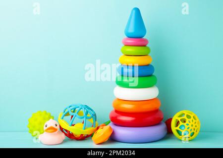 Toys collection for baby on blue background. Top view Stock Photo