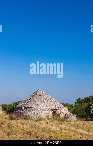 Trulli, typical houses near Castel del Monte, Apulia region, Italy Stock Photo