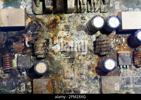 electronics board flooded with water with traces of corrosion. Stock Photo