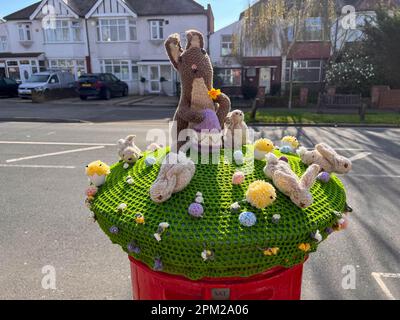 © Jeff Moore 08/04/2023 A knitted Easter scene seen on top of a post box in South Woodford, Essex this morning as the UK enjoy the bank holiday weeken Stock Photo