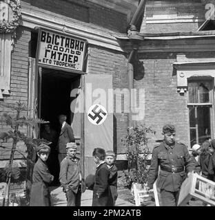 Historical World War II, 1940s, photo of a German Wehrmacht member in Latvia (Riga, Pskov and surroundings).'Exhibition Adolf Hitler and His Creation' Stock Photo