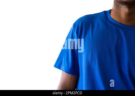 Midsection of african american man wearing blue t-shirt with copy space on white background Stock Photo