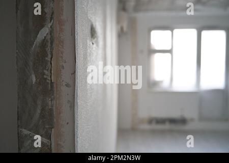 Interior of a new apartment without finishing in gray tones. Concept of repair and finishing works. Stock Photo