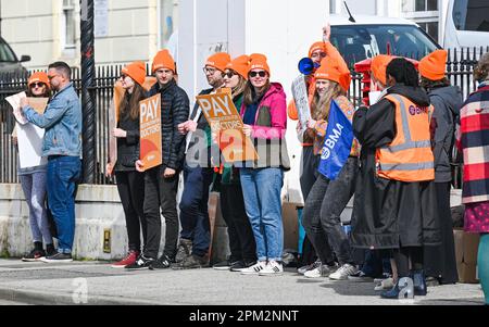 Brighton UK 11th April 2023 - Junior doctors on strike outside the Royal Sussex County Hospital in Brighton this morning as the British Medical Association begin their four day walk out in England : Credit Simon Dack / Alamy Live News Stock Photo