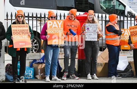 Brighton UK 11th April 2023 - Junior doctors on strike outside the Royal Sussex County Hospital in Brighton this morning as the British Medical Association begin their four day walk out in England : Credit Simon Dack / Alamy Live News Stock Photo