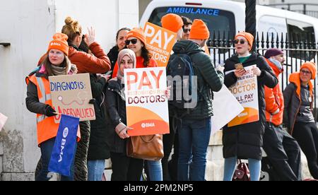 Brighton UK 11th April 2023 - Junior doctors on strike outside the Royal Sussex County Hospital in Brighton this morning as the British Medical Association begin their four day walk out in England : Credit Simon Dack / Alamy Live News Stock Photo