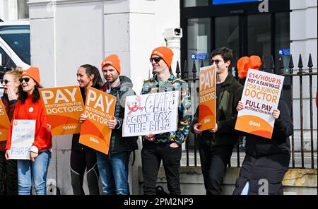 Brighton UK 11th April 2023 - Junior doctors on strike outside the Royal Sussex County Hospital in Brighton this morning as the British Medical Association begin their four day walk out in England : Credit Simon Dack / Alamy Live News Stock Photo