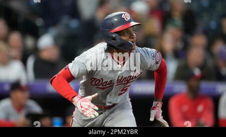 Washington Nationals shortstop CJ Abrams yawns behind his glove