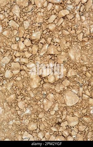 Red earth with stones, top view background Stock Photo