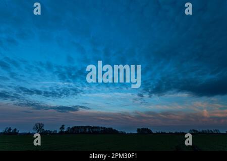 Abstract clouds in the evening blue sky, spring heaven Stock Photo
