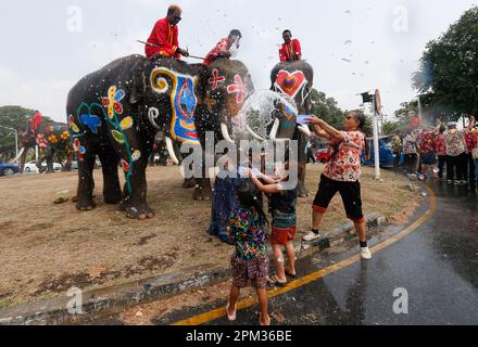 Ayutthaya, Thailand. 11th Apr, 2023. Elephants splash people with water in celebration of the Songkran Water Festival in Ayutthaya province, north of Bangkok. The event was held to promote tourism in Thailand. Credit: SOPA Images Limited/Alamy Live News Stock Photo