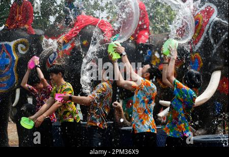 Ayutthaya, Thailand. 11th Apr, 2023. Elephants splash people with water in celebration of the Songkran Water Festival in Ayutthaya province, north of Bangkok. The event was held to promote tourism in Thailand. (Photo by Chaiwat Subprasom/SOPA Images/Sipa USA) Credit: Sipa USA/Alamy Live News Stock Photo
