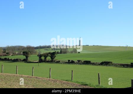 View across fields to Tolsford Hill and mast from above New Barn, Lyminge, Folkestone, Kent, England, United Kingdom Stock Photo