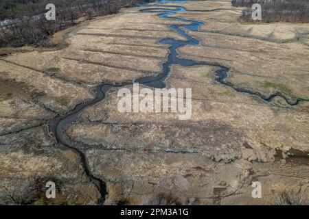 An aerial view of the marsh wetlands with dry grass in Pelham Bay in Bronx, New York on a sunny morning Stock Photo