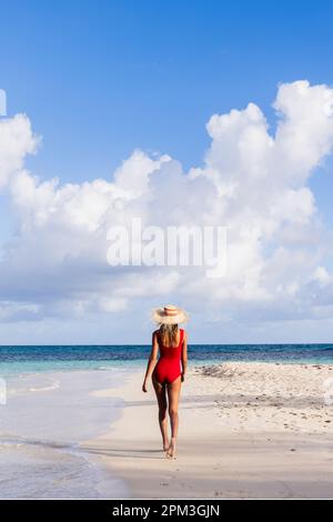 Young woman wearing red swimsuit in rooftop swimming pool in Kuala ...
