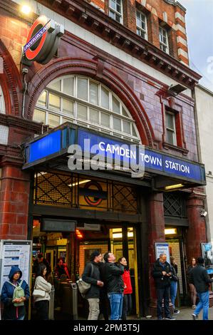 Camden Town, London, UK: Outside Camden Town tube station on Camden High Street. People standing by the underground station in the evening. Stock Photo