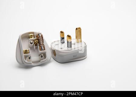 Electrical plug with a 13 amp fuse isolated on a white background Stock Photo