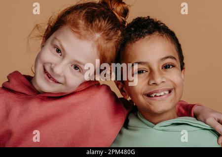 Boy with his friend posing during studio shoot. Stock Photo
