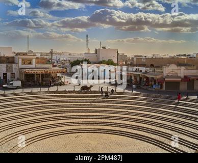 El Jem, Tunisia, January 10, 2023: Top view of the arena of the great Roman amphitheater of El Jem Stock Photo