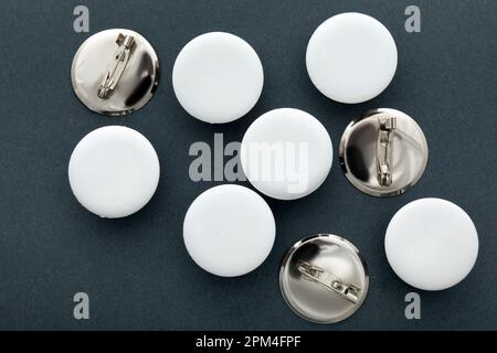 Blank white badges on grey background Stock Photo