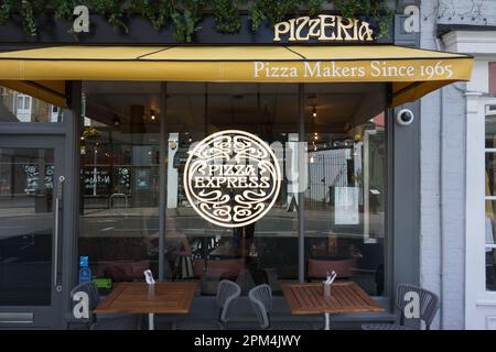 Pizza Express restaurant window, Barnes High Street, Barnes, London, SW13, England, UK - Pizza Makers since 1965 Stock Photo