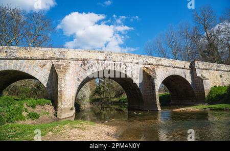 Roman bridge on old royal road from Paris to Sens over Yerres river near Evry-Gregy-sur-Yerre and medieval town of Brie-Comte-Robert. Stock Photo