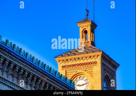 Clock tower building exterior. Old antique architecture of the Toledo AVE station. The transportation building is a famous place and tourist attractio Stock Photo