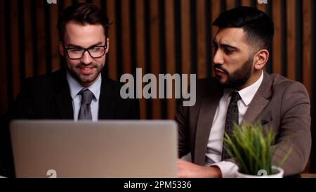 Business man having a discussion with his colleague in an office Stock Photo