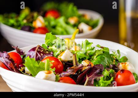 Salad greens in a bowl, extreme close up, selective focus. Stock Photo