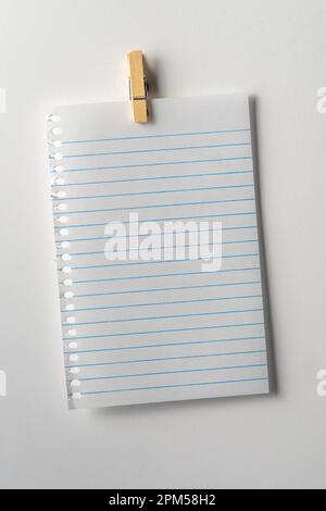 Blank note page paper on white background. Copy space. Close up. Stock Photo
