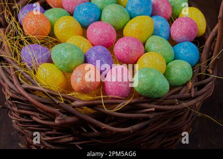 Basket of multi colored Easter eggs. Stock Photo
