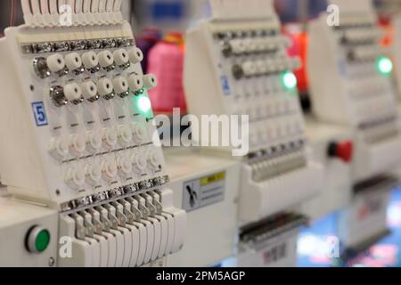 Multi head automatic embroidery machine close up. Selective focus. Stock Photo
