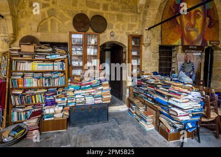 Bookstore at Büyük Han, Great Inn is one of the main tourist attractions of Nicosia. The old caravanserai consists of two floors. In the lower part of the almost square complex there are cafes and restaurants. In the upper part souvenir stores and handicrafts. Büyük Han, despite its popularity with tourists, is also visited by many locals in Nicosia, Cyprus Stock Photo
